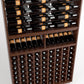 Medium brown wine rack close-up with top rails and rows of wine bottles in cubbies