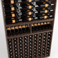 Wine rack detail with stacked bottles on rails and a lower grid of bottle compartments