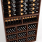 Close-up wine rack cabinet showing rows of bottles, glass-front cubbies, and dot holders