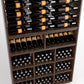 Wood wine storage unit showing dense top bottle rails and grid of bottle cubbies