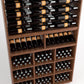 Wood wine display cabinet with stacked bottle rails and lower bottle cubby sections