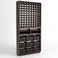 Dark wood wine rack front view with wine bottle grid and cubbies for stored bottles