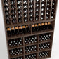 Wooden wine rack with multiple bottle slots, lower cubby bins, and a front display shelf