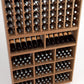 Wooden wine rack with upper bottle slots, mid display shelf, and lower cubby bins