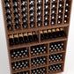 Wooden wine rack with multiple bottle slots and stacked cubby compartments for bottles