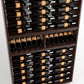 Wood wine bottle display with neatly arranged bottles in upper and lower compartments