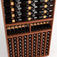 Wine bottle rack with front lower cubby grid of bottles and upper rail row of bottles