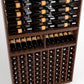 Full wooden cellar rack with top bottle rails and front grid of bottles with corks