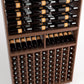 Close-up of wine bottle rack with horizontal rails and grid of vertical bottle holders