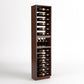 Tall dark wood wine bottle rack cabinet with a lower row of wine bottles lying down