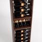 Close-up of dark wood wine bottle rack with front label view and horizontal holders