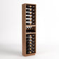 Light wood wine rack cabinet with four bottle rails and a bottom wine bottle tray