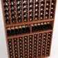 Wood wine bottle cellar rack, 9-column grid with bottles and stacked shelves