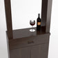 Wine tasting cabinet with mirror shelf, wine bottle, and stemmed glass on bar top