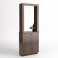 Dark wood cabinet tasting station with open frame and two doors below; wine glass display.