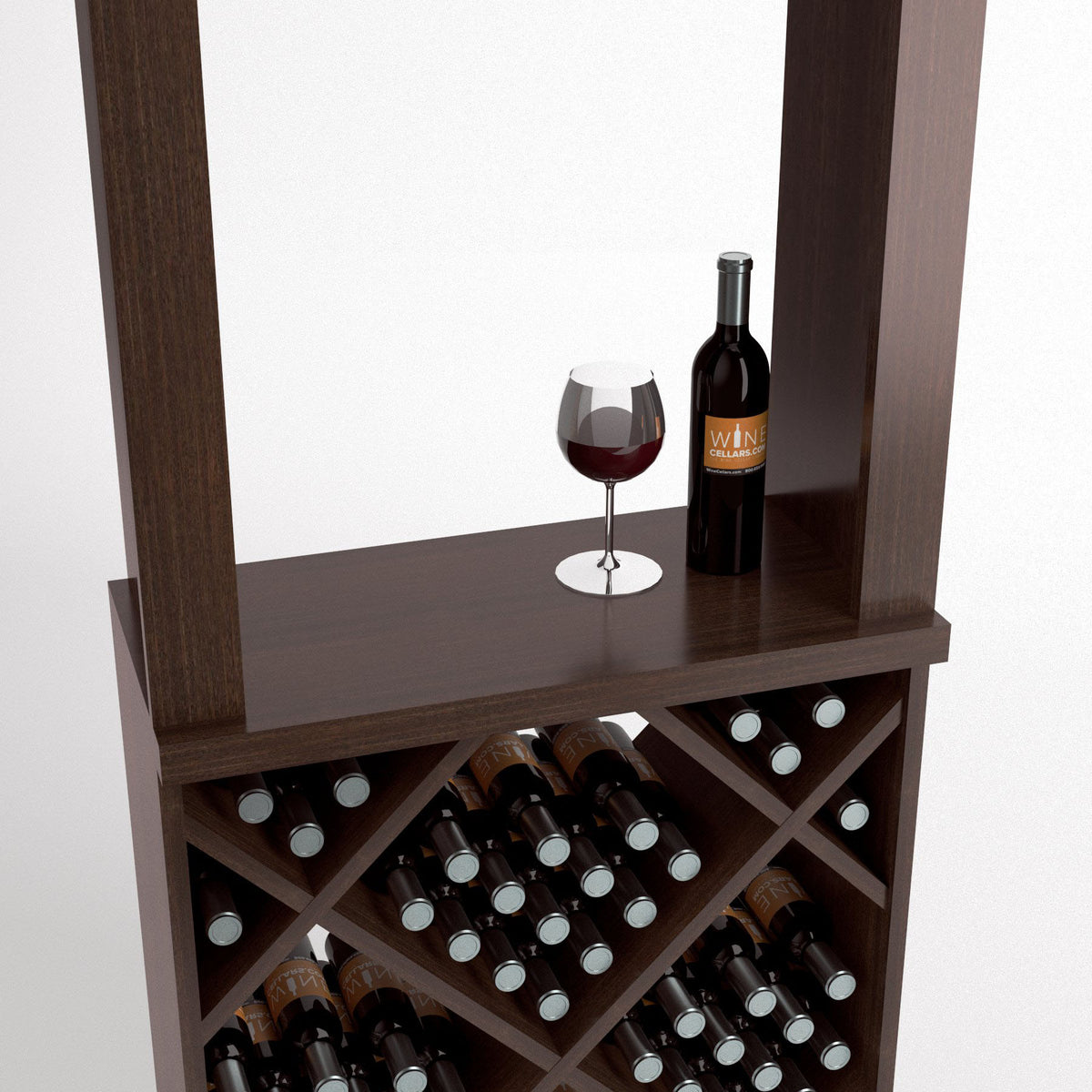 Wood wine tasting station close-up with wine glass and bottle on top and wine racks below.