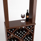 Wood wine tasting station with wine glass and bottle on top shelf and bottle rack below.