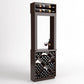 Tall wood wine tasting station with top bottle shelf, center glass and bottle, side storage.