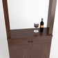 Brown wood wine tasting cabinet with open top ledge, glass and bottle on surface