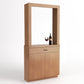 Light wood cabinet-style wine tasting station with framed opening, drawer, and doors