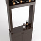 Close-up of wood wine tasting cabinet with bottle rack and countertop glass set