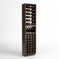 Tall dark wood wine rack column with bottle rails, wine cubbies, and corked bottle storage