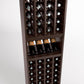 4-column wine cellar rack close-up with bottle cubbies, wine glass shelf, dark wood.