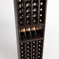 4-column wine cellar rack close-up with bottle cubbies, wine glass shelf, dark brown wood.