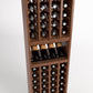 Front view of a dark wood wine rack with bottle slots, a front row wine tray, and lower cubbies