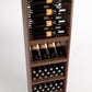 Tall wooden wine rack with four bottle rails and stacked bins for wine bottle storage