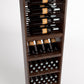 Wood wine rack shelves with bottle rails, stacked wine bottles, and cork bottle bins
