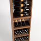 Wood wine rack with bottle rails, bottle shelves, and cork bottle bins below
