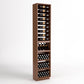 Tall dark-wood wine rack with 4-column bottle rails, wine bins, and cork bottle storage