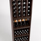 Wooden 4-column wine bottle rack with cubby shelves and bottles displayed
