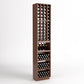 Tall walnut-toned wine rack with 4-column bottle cubbies and three lower storage bins