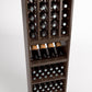 Wood wine bottle rack with four vertical columns and lower bottle storage shelves