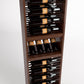 Dark brown wine bottle rack with 4-column rails holding wine bottles