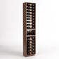 Dark wood wine bottle and glass display rack with multiple horizontal slots