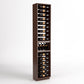 Light brown wood wine bottle and glass display rack with multiple horizontal bottle slots