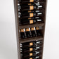 Dark wood wine bottle rack with 4-column rails and bottle display slots