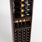 Wine rack interior showing bottle cradles, glass rest shelf, and wine bottle row
