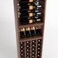 Wine rack close view with bottle slots, shelf with glasses, and front wine cubbies