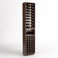 Freestanding dark wood wine rack with stacked bottle slots, glass rests, and wine cubbies