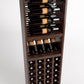 Close view of wine rack showing black bottle cradles and front wine bottle cubbies