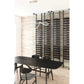 Low-profile wine bottle storage rack with dark posts and multi-tier black ledges
