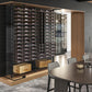 Wine storage wall with bottle racks on dark posts and an adjacent cabinet opening.