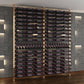Evolution low-profile bottle display post kit, corner view with dark rows and frame posts