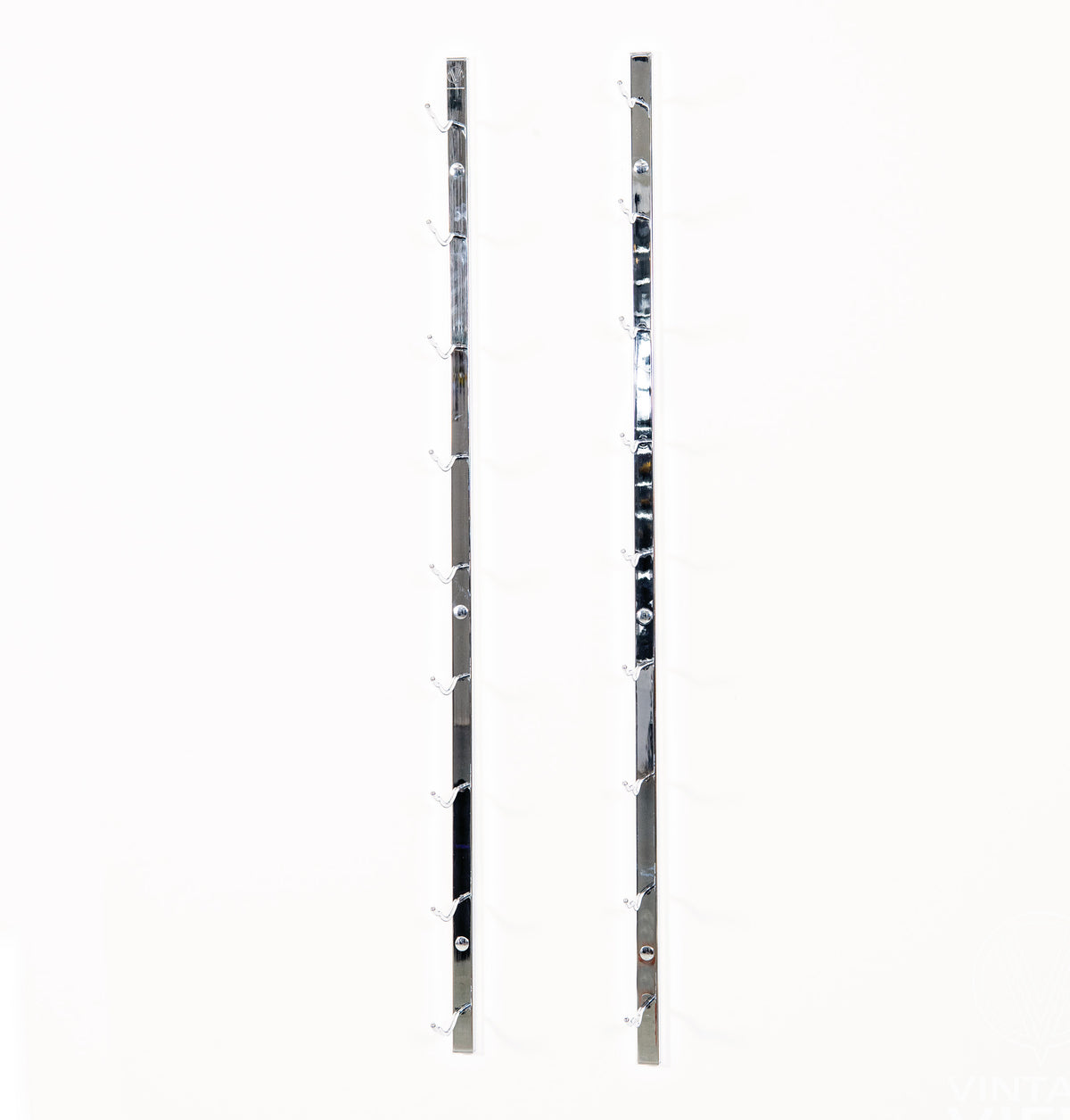 Metal wall wine rack with two vertical rails and bottle holder brackets