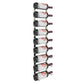 Wall-mounted wine bottle rack holding white wine bottles on metal bottle pegs
