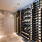 Corner wine bottle wall display with tightly arranged bottles and metal back supports